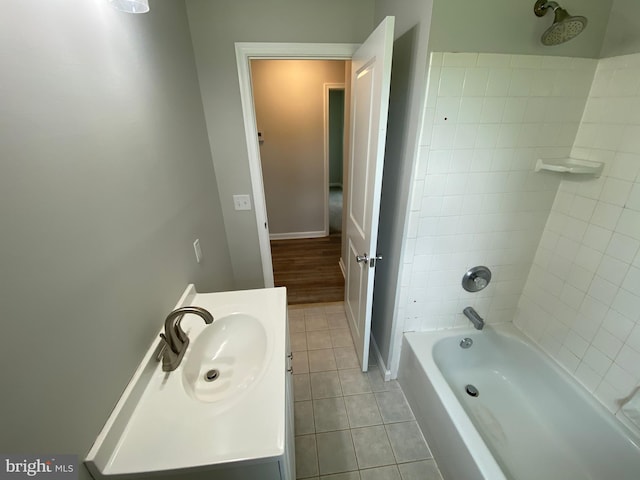 bathroom with vanity, tile patterned floors, and tiled shower / bath