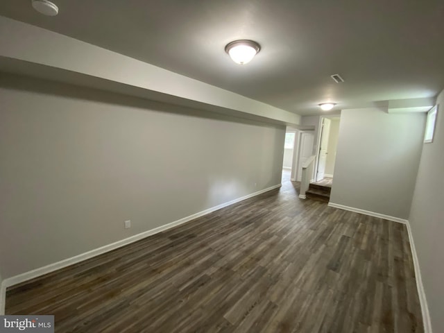 basement featuring dark hardwood / wood-style floors