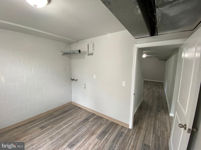 basement with dark hardwood / wood-style flooring