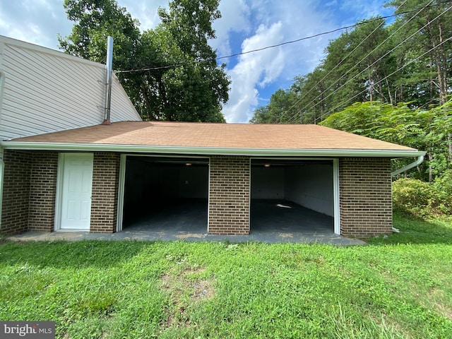 garage with a yard