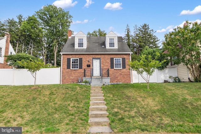 new england style home with a front lawn