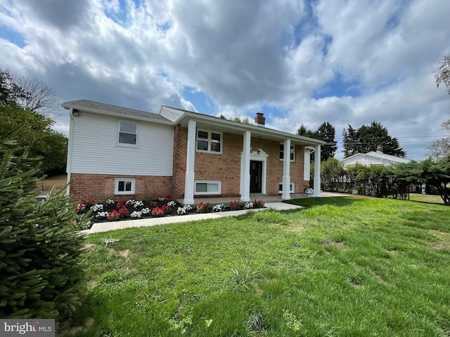 back of house featuring a yard