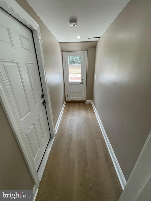 doorway to outside with light hardwood / wood-style floors