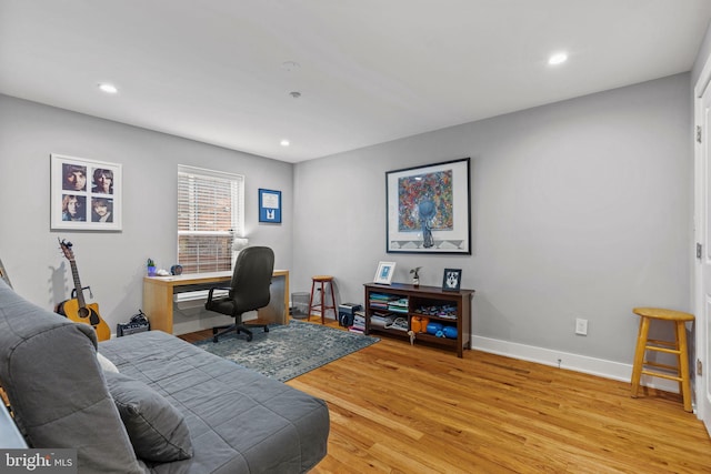 office with light wood-type flooring