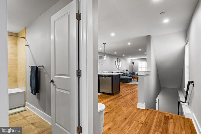 bathroom with vanity, hardwood / wood-style flooring, and separate shower and tub