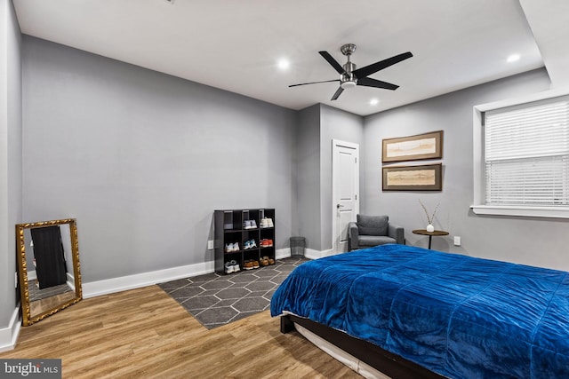 bedroom featuring dark wood-type flooring and ceiling fan