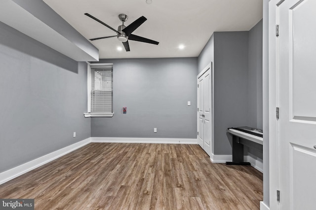 interior space with ceiling fan and light hardwood / wood-style flooring