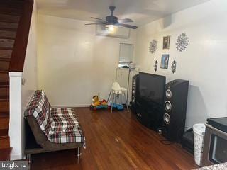 interior space featuring ceiling fan and dark hardwood / wood-style floors