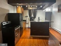 kitchen with stove and light wood-type flooring