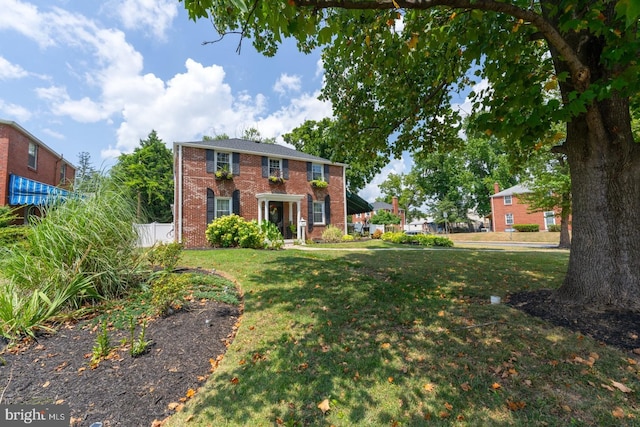 view of front of home with a front yard