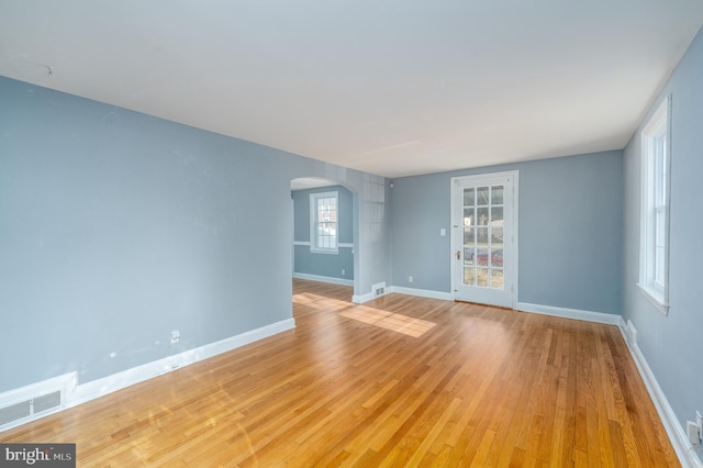 spare room with light hardwood / wood-style floors