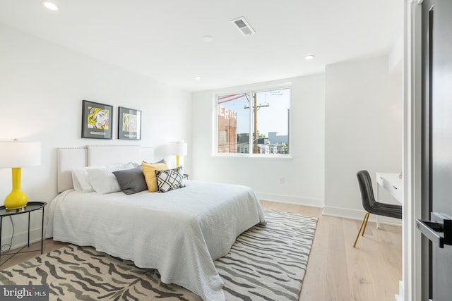 bedroom with light hardwood / wood-style flooring