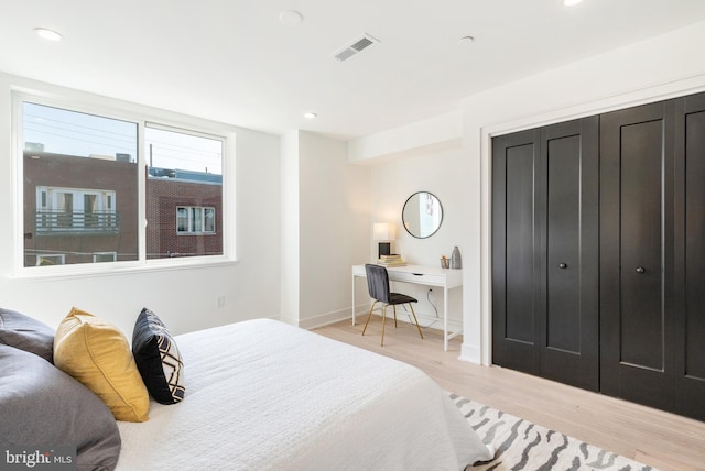 bedroom with light hardwood / wood-style flooring