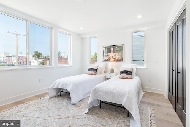 bedroom with light hardwood / wood-style floors