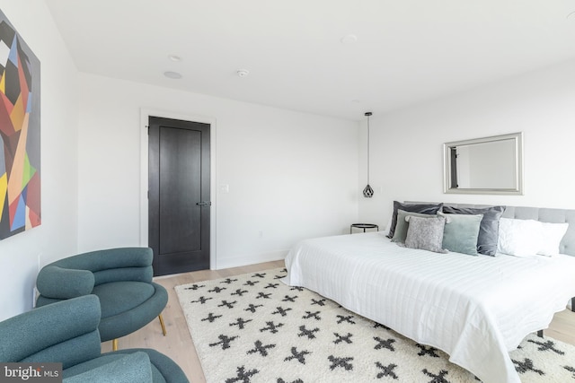 bedroom with light wood-type flooring