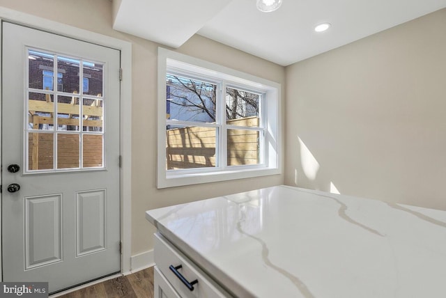 doorway with recessed lighting and dark wood-style flooring