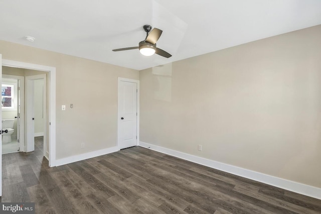 unfurnished bedroom featuring dark wood-style floors, baseboards, and a ceiling fan