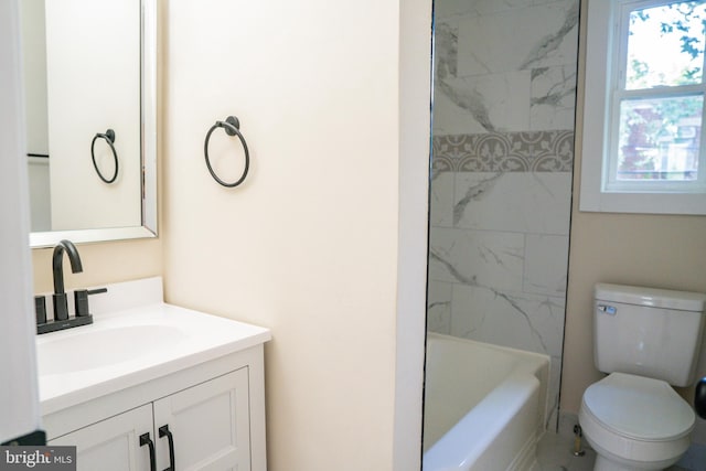 bathroom featuring toilet, washtub / shower combination, and vanity