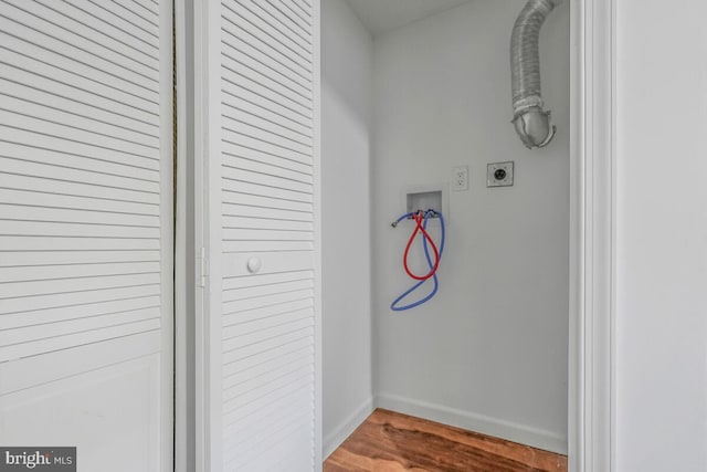 interior space featuring baseboards and wood finished floors