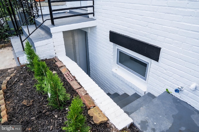 view of property exterior with brick siding