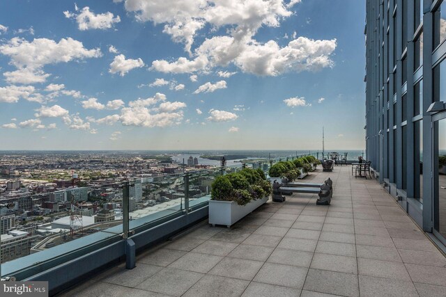 exterior space with a balcony and a water view