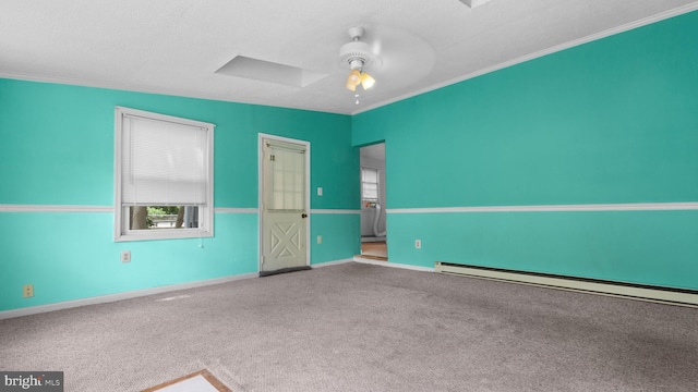 spare room with crown molding, carpet flooring, ceiling fan, and baseboard heating