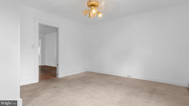 unfurnished room featuring ceiling fan and carpet floors