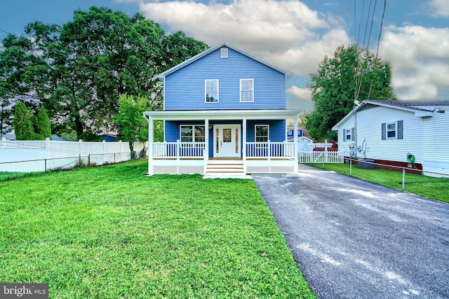 bungalow with a front lawn and a porch