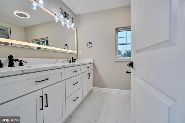 bathroom featuring tile patterned flooring and vanity