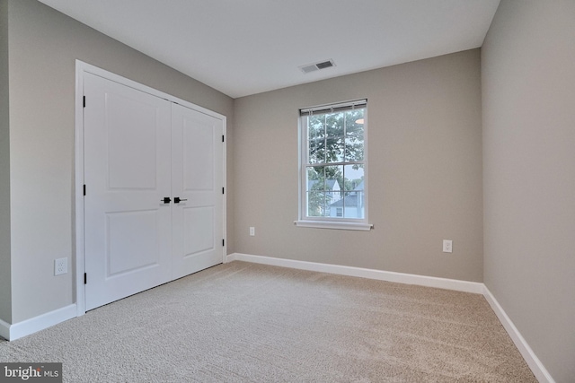 unfurnished bedroom featuring carpet flooring