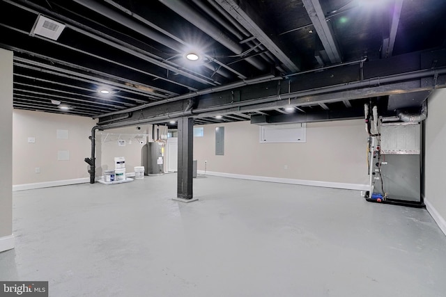 basement with heating unit, electric panel, and water heater