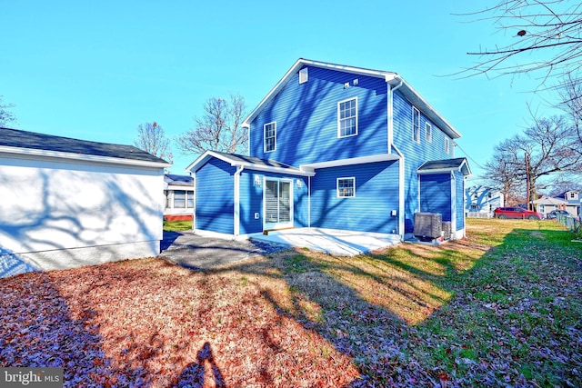 view of front of property with a front yard and a patio area