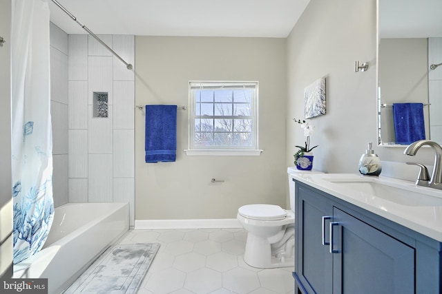 bathroom with tile patterned flooring, vanity, and toilet