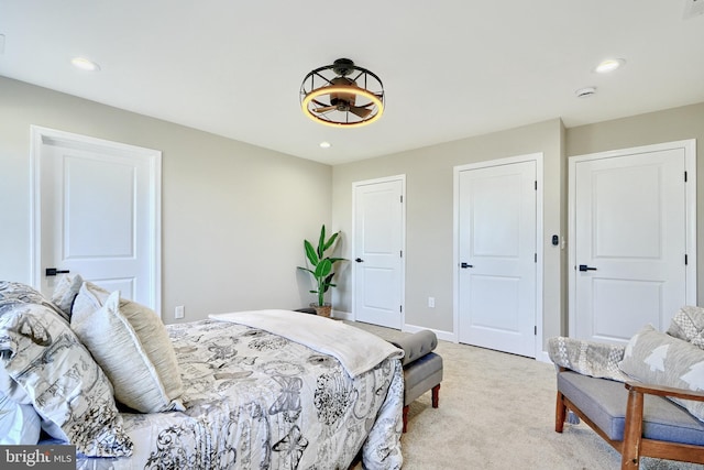 bedroom featuring light carpet