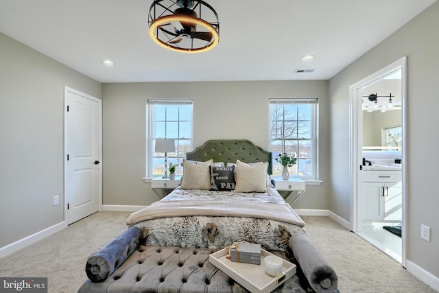 bedroom with light colored carpet