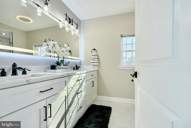 bathroom featuring tile patterned flooring and vanity