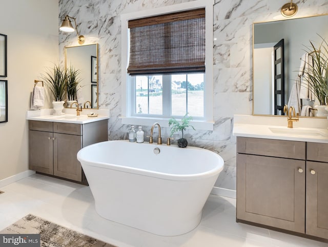 bathroom with tile walls, a bath, and vanity