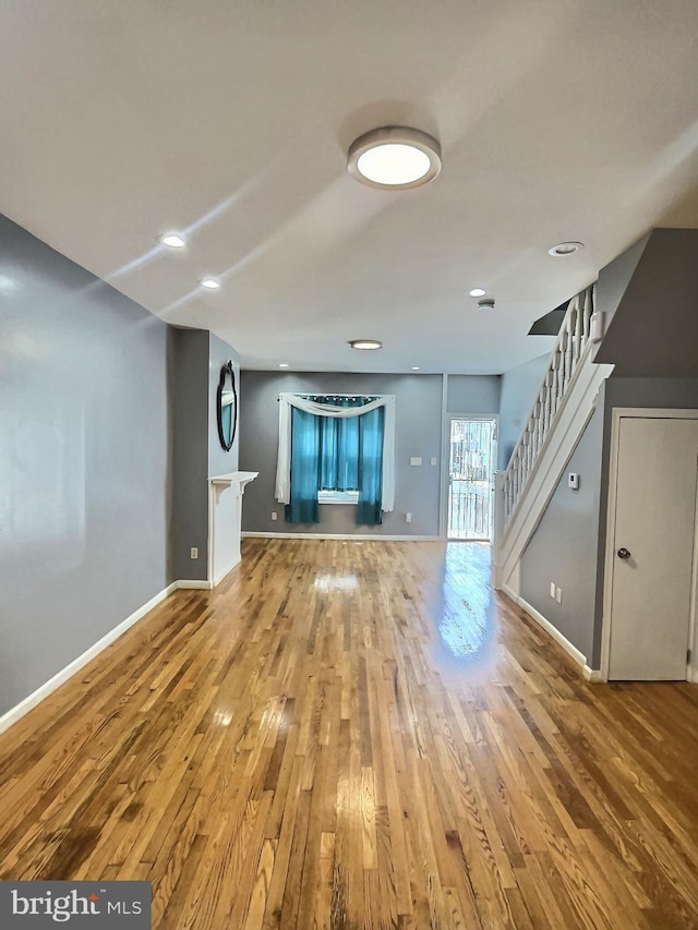 unfurnished living room with light hardwood / wood-style floors