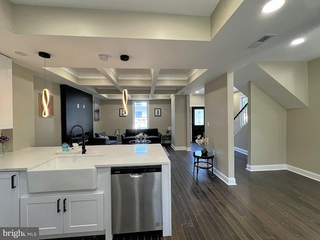 kitchen with white cabinetry, stainless steel dishwasher, beamed ceiling, coffered ceiling, and dark hardwood / wood-style floors