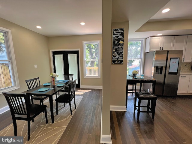 dining room with french doors and dark wood-type flooring