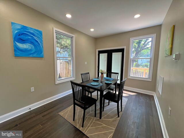 dining space featuring dark hardwood / wood-style floors