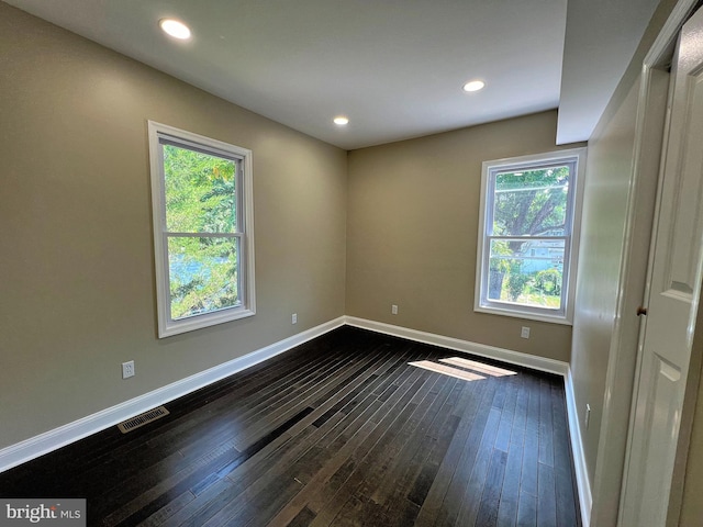 empty room featuring dark hardwood / wood-style floors