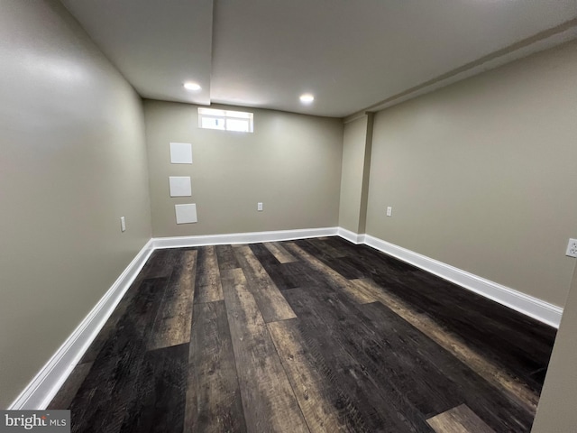 basement featuring dark hardwood / wood-style flooring