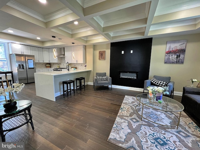 living room featuring beam ceiling, dark hardwood / wood-style floors, and coffered ceiling