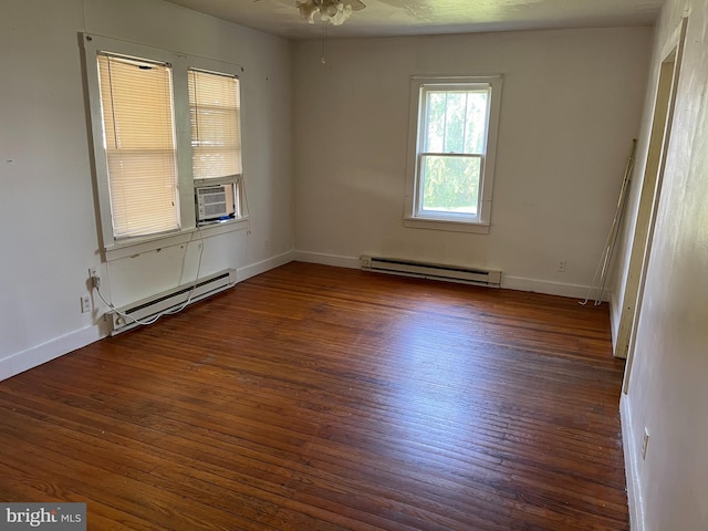 empty room featuring a baseboard heating unit, ceiling fan, and dark hardwood / wood-style flooring