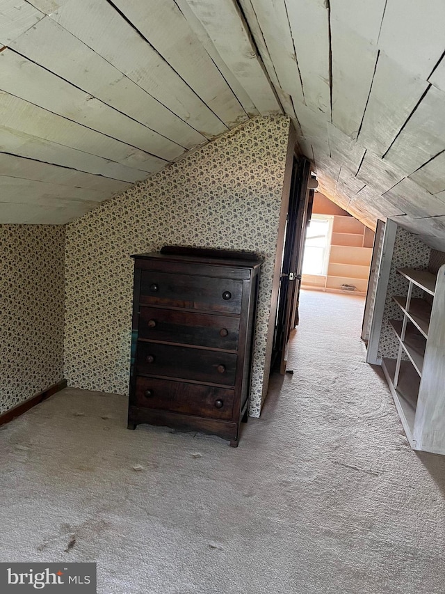 bonus room with vaulted ceiling, wooden ceiling, and carpet floors