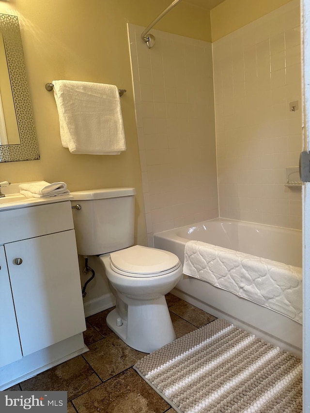 full bathroom with vanity, washtub / shower combination, and toilet