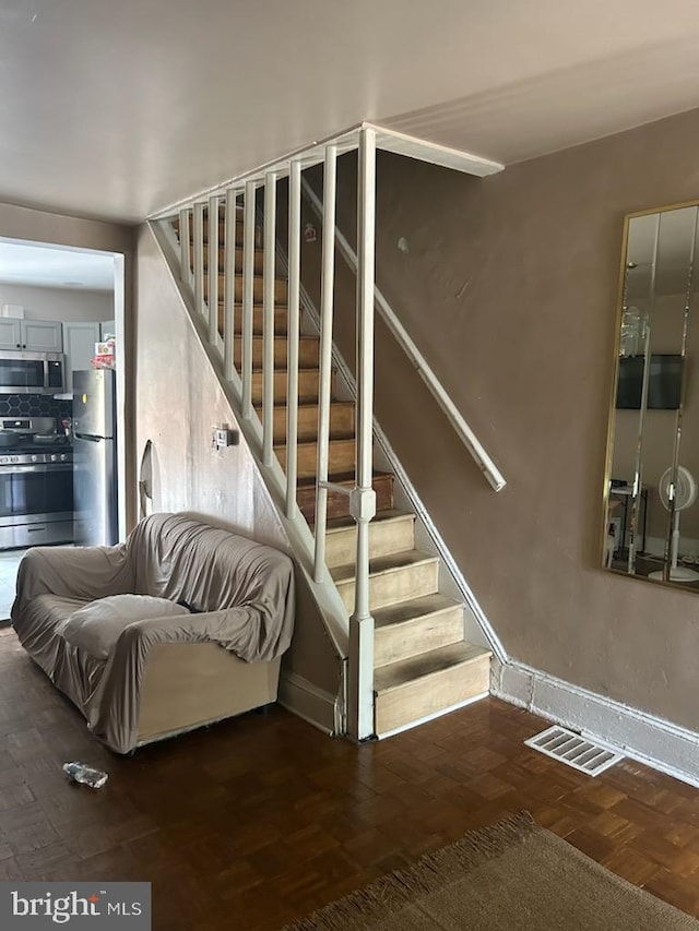 staircase with parquet flooring