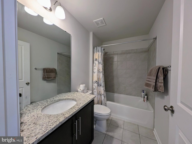 full bathroom featuring tile patterned flooring, vanity, toilet, and shower / bath combo with shower curtain