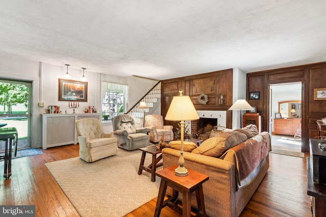 living room featuring hardwood / wood-style flooring and a fireplace